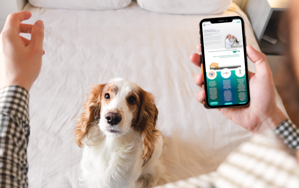 man looking at app selling the benefits of your pet health plan